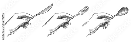 Fotografía Engraved hands holding cutlery