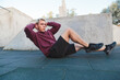 © vladdeep - Man doing exercises for abdominals outdoors. Alone workout on fitness area
