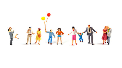 miniature people on white background.