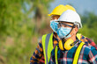 © visoot - Solar power plant,Electrician wearing a medicine healthcare mask working and checking solar plant at solar power station,Climate change and renewable energy.
