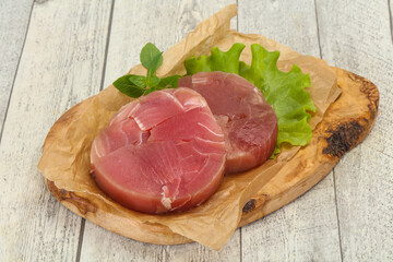 Raw tuna round steak for grill