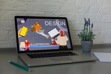 Closeup shot of laptop on desk. Responsive design web page on their screen. Modern devices on desk at office.