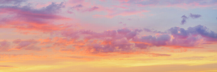 Wall Mural - dramatic bright colored clouds at sunset
