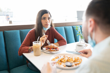 Wall Mural - Couple Having Sweet Food In Restaurant