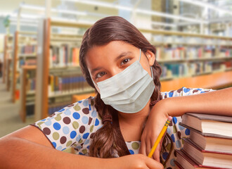 Wall Mural - Hispanic Girl Student Wearing Face Mask Studying in Library