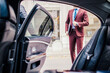 © qunica.com - Businessman near the open door car