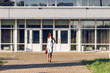 © Марина Шавловская - business woman in a dress walking through the city