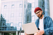 © mykolastock - Portrait of handsome bearded hipster male student in spectacles looking straight at camera