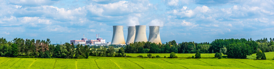 nuclear power plant on the background of beautiful green summer meadow. temelin, czech republic