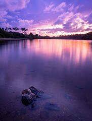 Sticker - Breathtaking scenery of the sunset clouds reflecting in Lac du Jaunay, France