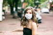 © Sean Locke - Teen Girl Wearing Face Mask Walking On A Public Street