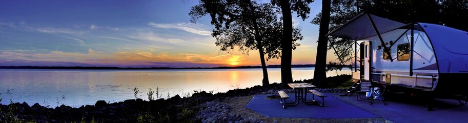 travel trailer camping by the mississippi river at sunset in thomson causway illinois