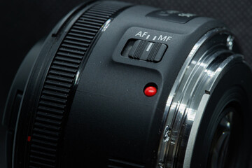 Macro closeup photo of lens to dslr camera on dark background