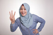 © airdone - Muslim Woman Smiling and Shows Number Three Sign Gesture