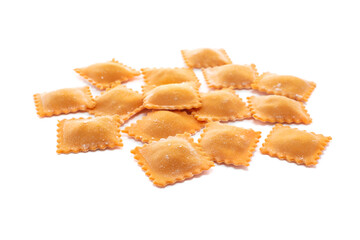 Wall Mural - Fresh ravioli pasta colored with paprika isolated on a white background