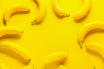 Ripe bananas on color background