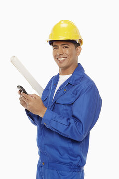 Construction worker sending a text message