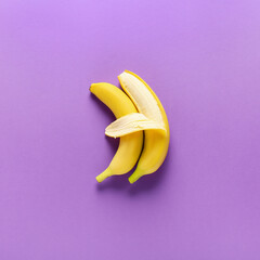 Ripe bananas on color background