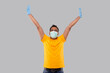© Alex - Indian Man Very Happy and Excited, Raising arms, Celebrating a Victory or Success Wearing Medical Mask and Gloves. Winner Sign. Indian man Isolated