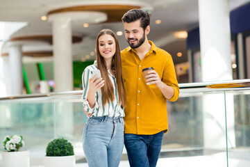 Poster - Portrait of his he her she nice attractive lovely pretty charming cheerful cheery couple embracing spending free time drinking latte using device blogging visiting commercial building indoors