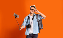 Young Male Traveler With Glasses Taking Positive Selfie