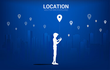 Aufkleber - Silhouette of man with mobile and GPS icon with city background. concept of location and facility place , GPS technology