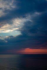 Poster - Vertical shot of the sunset in Rimini beach Italy