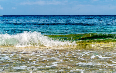 Sea scape with small wave splash in front