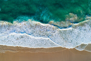  Aerial view beach waves, blue/green ocean, golden sandy beach