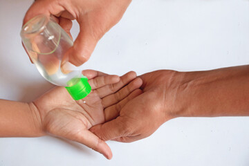  Hand getting sanitized with hand sanitizer gel