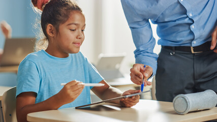 Poster - Elementary School Computer Science Class: Smart Girl Uses Digital Tablet Computer, Friendly Teacher Helps Her by Explaining Lesson and Asignment. Children Getting Modern Education