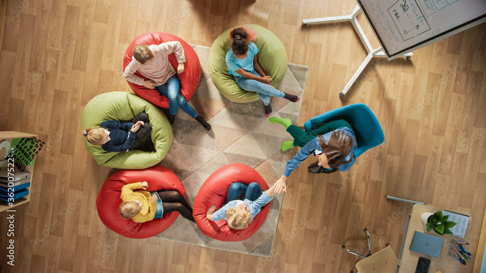 Elementary School Creativity Classroom: Children Sitting on the Bean ...