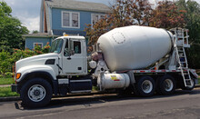 Concrete Mixer Truck Parked On Residential Neighborhood Street.