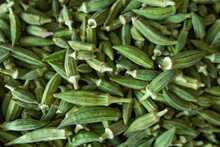 Fresh Green Okra On A Woven Basket Close Up And Top View