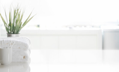 Wall Mural - Clean white towel on white table, copy space.