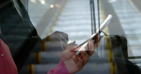 Poster - Person using smartphone against businessman at airport using digital tablet