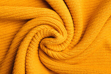 Abstract Fresh Colorful Yellow Knitted Pattern Background Texture. Orange Knitted Pattern Of Acrylic Yarns, Closeup.