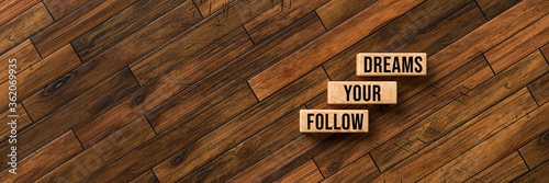 Cuadros en Lienzo cubes with message FOLLOW YOUR DREAMS on wooden background