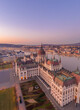 Aerial drone shot of Dome of Hungarian Parliament at dawn before sunrise in Budapest morning