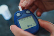 © mercankaya - Medicine, Diabetes, Glycemia, Health care and people concept - close up of female using lancelet on finger to checking blood sugar level by Glucose meter