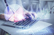 © peshkova - Multi exposure of woman hands typing on computer and financial graph hologram drawing. Stock market analysis concept.