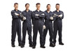 Team of five auto mechanic workers in uniforms