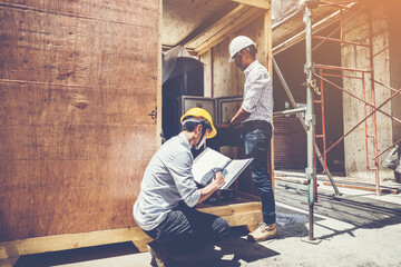 Wall Mural - Project engineer, engineer and architect working on construction site, construction site engineer working on and inspect blueprint of project