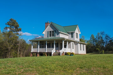 Big house in the countryside on blue sky background