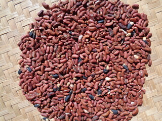 Long bean seeds with a natural background. The seeds are on drying process