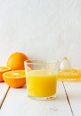 Freshly squeezed orange juice on a white background. Healthy eating. Diet. Vegetarian food.