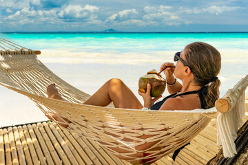 Wall Mural - Woman relaxing at the beach