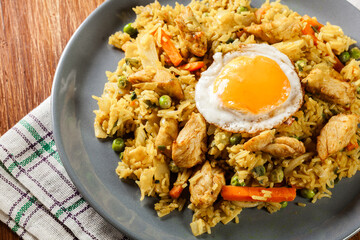 Sticker - Fried rice nasi goreng with chicken egg and vegetables on a plat