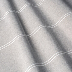Pattern on gray fabric in a strip. Fabric with natural texture, Cloth backdrop.
