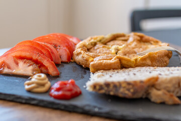 breakfast with eggs, tomatoes and bread